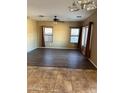 Spacious living room with tile and laminate flooring at 9406 W Elwood St, Tolleson, AZ 85353