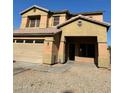 Two story home with large front yard and attached garage at 9406 W Elwood St, Tolleson, AZ 85353