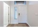 Bright entryway with wood-look floors and access to other rooms at 7082 E Palo Brea Dr, Gold Canyon, AZ 85118