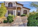 Landscaped front yard with a walkway leading to the entry of a two-story house at 15439 E Acacia Way, Fountain Hills, AZ 85268