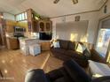 Open concept kitchen and living room in a mobile home at 1206 W Klamath Dr, Apache Junction, AZ 85119