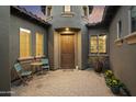 Private courtyard with seating area and brick pavers at 2378 N 158Th Dr, Goodyear, AZ 85395