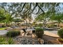 Inviting pool and spa area with lush landscaping and seating at 9770 N 130Th St, Scottsdale, AZ 85259