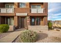 Townhouse exterior with private entrance and landscaping at 6745 N 93Rd Ave # 1133, Glendale, AZ 85305