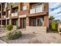 Townhouse exterior with private entrance and landscaping at 6745 N 93Rd Ave # 1133, Glendale, AZ 85305