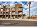 Townhouse building exterior with street view and landscaping at 6745 N 93Rd Ave # 1133, Glendale, AZ 85305