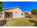 Spacious backyard with grassy area and covered patio at 2725 W Bowker St, Phoenix, AZ 85041