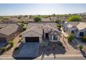 Aerial view of a house with desert landscaping and neighborhood at 5353 W Buckskin Dr, Eloy, AZ 85131