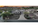 Stunning aerial view of a house with a paved driveway at 4126 S Last Chance Trl, Gold Canyon, AZ 85118