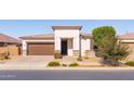 Single-story home with brown garage door and landscaping at 22850 E Calle Luna --, Queen Creek, AZ 85142