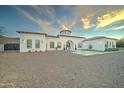 White stucco exterior with a grand entrance and expansive driveway at 3923 W Fox Rd, Laveen, AZ 85339