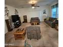 Spacious living room featuring comfortable seating and ample natural light at 5515 E Player Pl, Mesa, AZ 85215