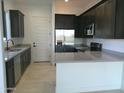 Modern kitchen with stainless steel appliances and an island at 846 N Pueblo Dr # 140, Casa Grande, AZ 85122