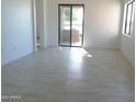 Bright and airy living room with tile floors and sliding doors at 846 N Pueblo Dr # 140, Casa Grande, AZ 85122
