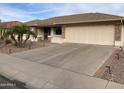 Single-story home with attached two-car garage and desert landscaping at 2521 S Copperwood --, Mesa, AZ 85209