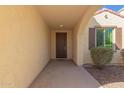 Covered entryway with dark brown door and arched detail at 3674 N Palo Verde Dr, Florence, AZ 85132