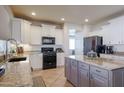 Spacious kitchen with granite countertops and modern appliances at 14586 W Columbus Ave, Goodyear, AZ 85395