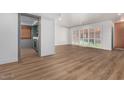 Open living area with wood-look flooring and access to patio at 103 E Palm Ln # A, Phoenix, AZ 85004
