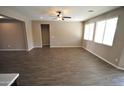 Spacious living room with tile flooring and large windows at 17437 W Victory St, Goodyear, AZ 85338