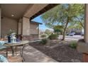 Relaxing front porch with small table and chairs, overlooking the neighborhood at 19428 W Colter St, Litchfield Park, AZ 85340