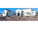 Stunning Spanish-style home with a beautiful landscape and a large driveway at 18610 W Porter Dr # 93, Goodyear, AZ 85338