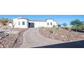 Long paved driveway leading to a beautiful Spanish-style home at 18610 W Porter Dr # 93, Goodyear, AZ 85338