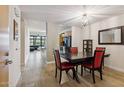 Dining room with a dark wood table and red chairs at 4808 N 24Th St # 303, Phoenix, AZ 85016