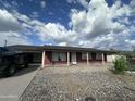 Brick ranch house with covered porch and driveway at 4232 W Citrus Way, Phoenix, AZ 85019