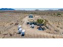 Aerial view showing a house, detached workshop, and large lot at 43809 W Avalon Dr, Tonopah, AZ 85354