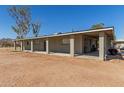 Ranch style home with covered patio and desert landscaping at 11841 N Lavern Ln, Maricopa, AZ 85139