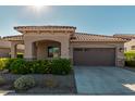 House exterior featuring a two-car garage and well-maintained landscaping at 20403 W Calle Encorvada --, Buckeye, AZ 85396