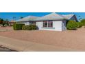 View of the house exterior showcasing landscaping and a clean design at 11451 S Pawnee Cir, Phoenix, AZ 85044