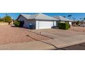 House exterior features a carport and well-manicured landscaping at 11451 S Pawnee Cir, Phoenix, AZ 85044