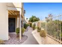 Pathway leading to condo entrance with iron fencing at 1425 E Desert Cove Ave # 49, Phoenix, AZ 85020
