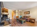 Living room with southwestern decor and hardwood floors at 1425 E Desert Cove Ave # 49, Phoenix, AZ 85020