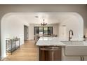 Open concept kitchen with marble island and farmhouse sink at 2301 E Osborn Rd, Phoenix, AZ 85016