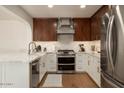 Renovated kitchen, stainless steel appliances, hardwood floors at 2301 E Osborn Rd, Phoenix, AZ 85016