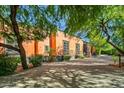 Spanish-style home with large wooden doors and lush landscaping at 8100 N 68Th St, Paradise Valley, AZ 85253