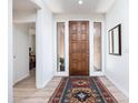 Bright entryway with wood door and view to bedroom at 27504 N Montana Dr, Rio Verde, AZ 85263