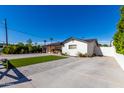 Front view of a remodeled home with new landscaping at 4002 E Clarendon Ave, Phoenix, AZ 85018