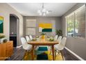 Bright dining room featuring a mid-century modern dining set and stylish decor at 1695 E Mia Ln, Gilbert, AZ 85298