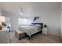 Main bedroom with a king-size bed and plenty of natural light at 4610 N 68Th St # 407, Scottsdale, AZ 85251