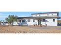 Modern home exterior with metal roof and a minimalist design at 41644 N 277Th Ave, Morristown, AZ 85342