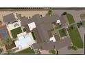 Bird's-eye view of a luxury estate with pool, sports court, and ample grounds at 5704 N Wilkinson Rd, Paradise Valley, AZ 85253