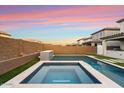 Luxury pool and spa with a tiled water feature and spacious backyard at 19834 W Rancho Dr, Litchfield Park, AZ 85340