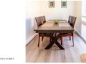 Dining area with a dark wood table and four chairs at 4610 N 68Th St # 414, Scottsdale, AZ 85251