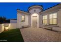 Welcoming front entry with landscaping and seating at 20594 W Pasadena Ave, Buckeye, AZ 85396