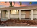 Front entrance view of a single-story home with a light-colored door at 10452 W Meade Dr, Sun City, AZ 85351