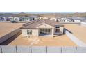 Aerial view of house showcasing backyard, block wall, and desert landscape at 13637 W Hackamore Dr, Peoria, AZ 85383