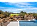 Scenic pool area overlooking a golf course and mountains at 9989 E Aleka Way # 337, Scottsdale, AZ 85262